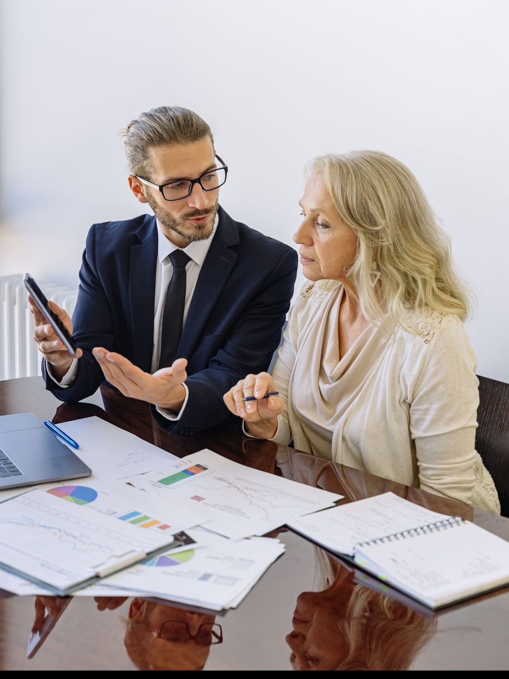 A finance advisor walking a business owner through her numbers